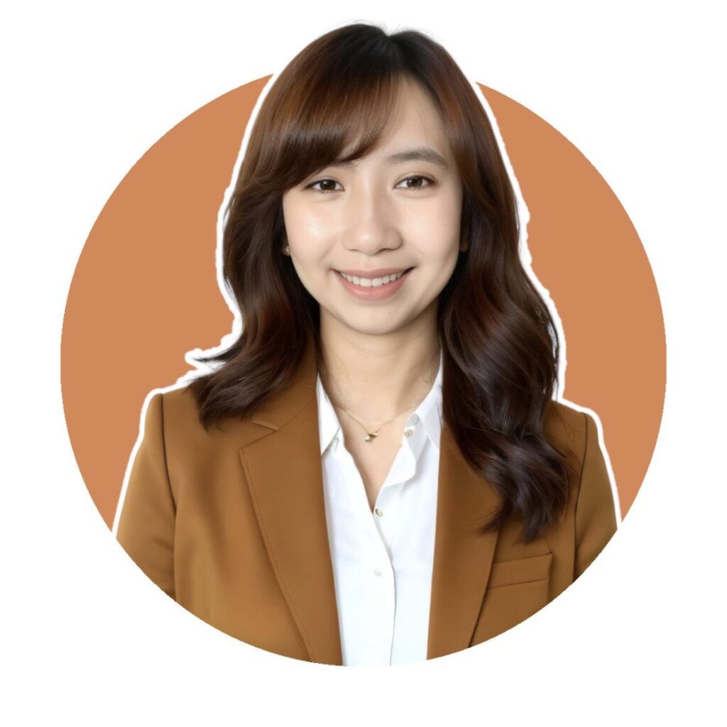 A professional formal photo of Anne, wearing a white top and blazer, smiling confidently against a neutral background.